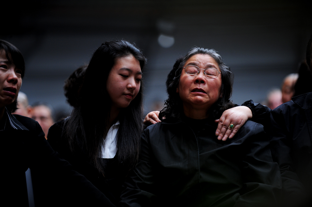 Lin Family Funeral. Mother Zhu Fengqin (right) of murder victims Lin Min and Lin Yunli and grandmother of their sons Henry, 12, and Terry, nine who were found bludgeoned in their beds at North Epping 2009